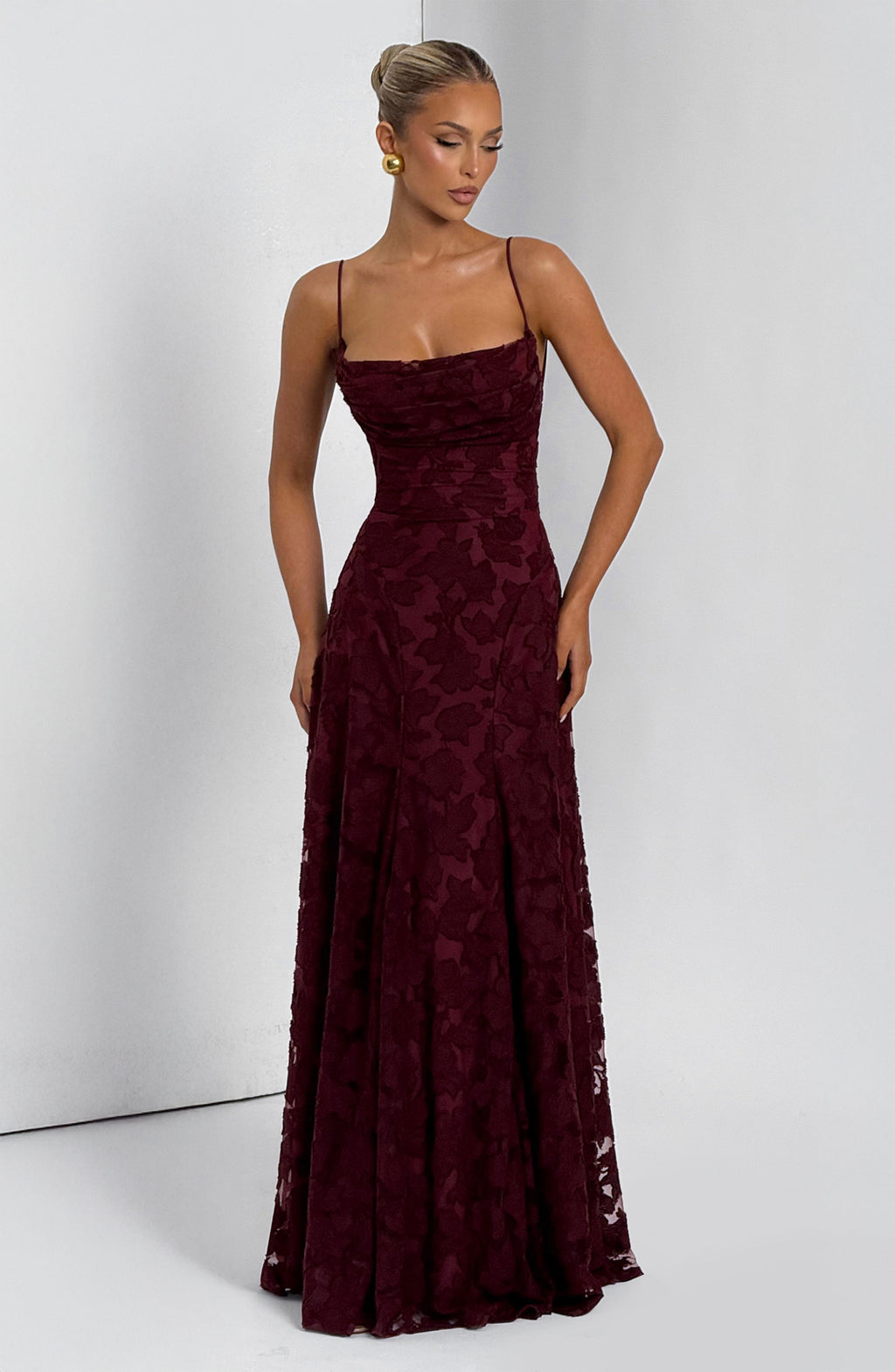 Ladies' maxi dress with waterfall neckline, spaghetti straps, floral pattern, and lace-up back