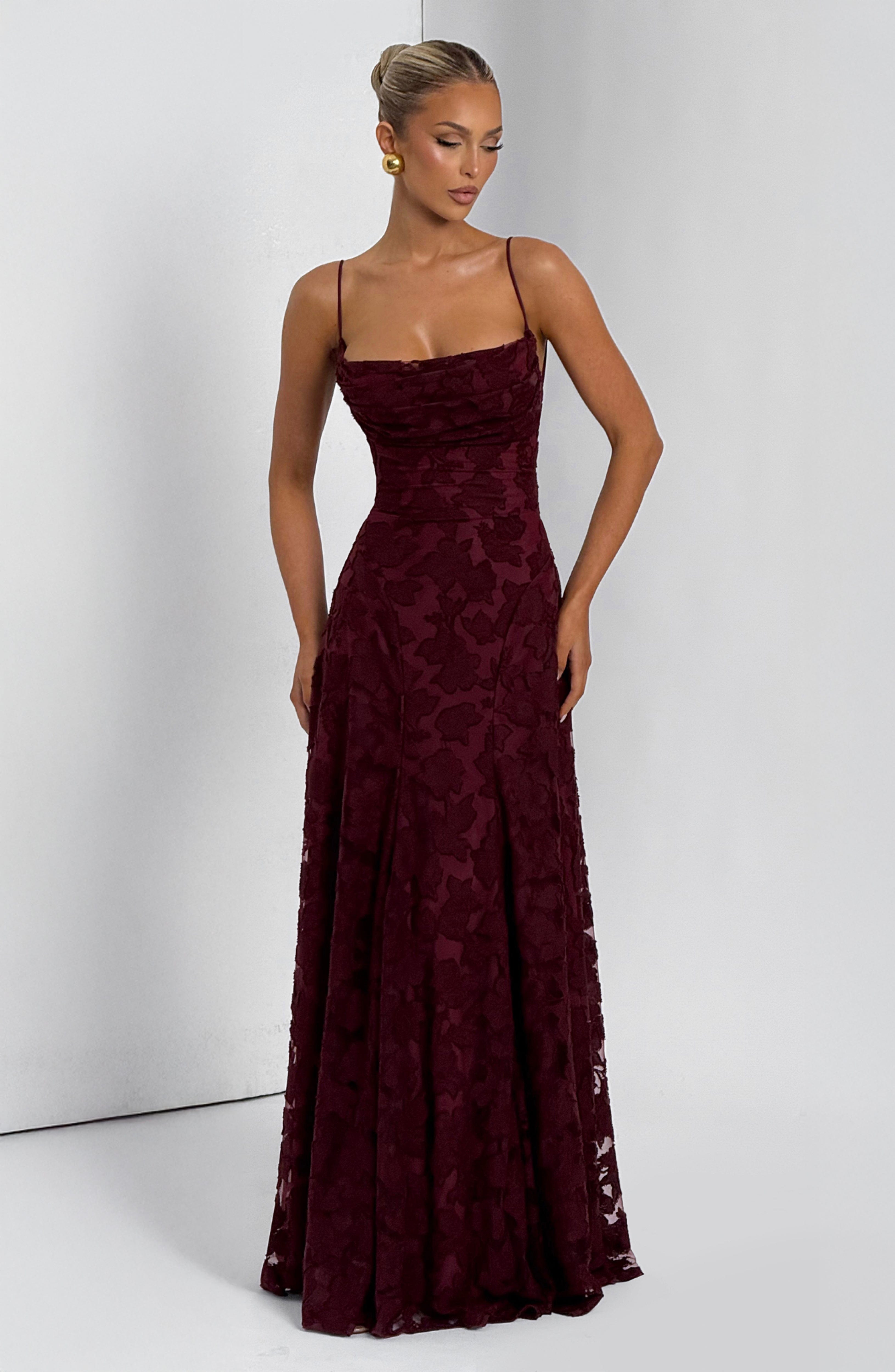 Ladies' maxi dress with waterfall neckline, spaghetti straps, floral pattern, and lace-up back