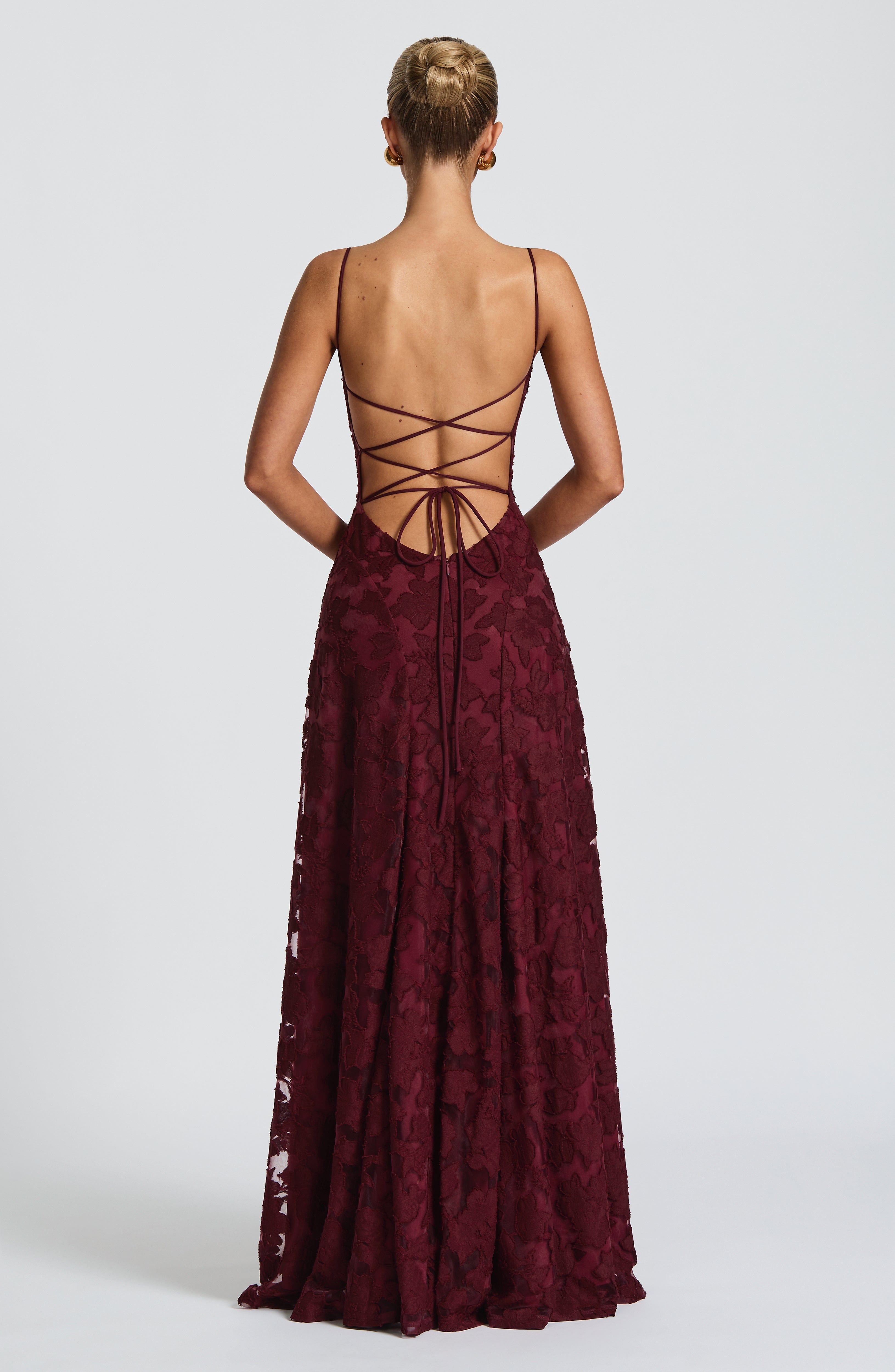 Ladies' maxi dress with waterfall neckline, spaghetti straps, floral pattern, and lace-up back