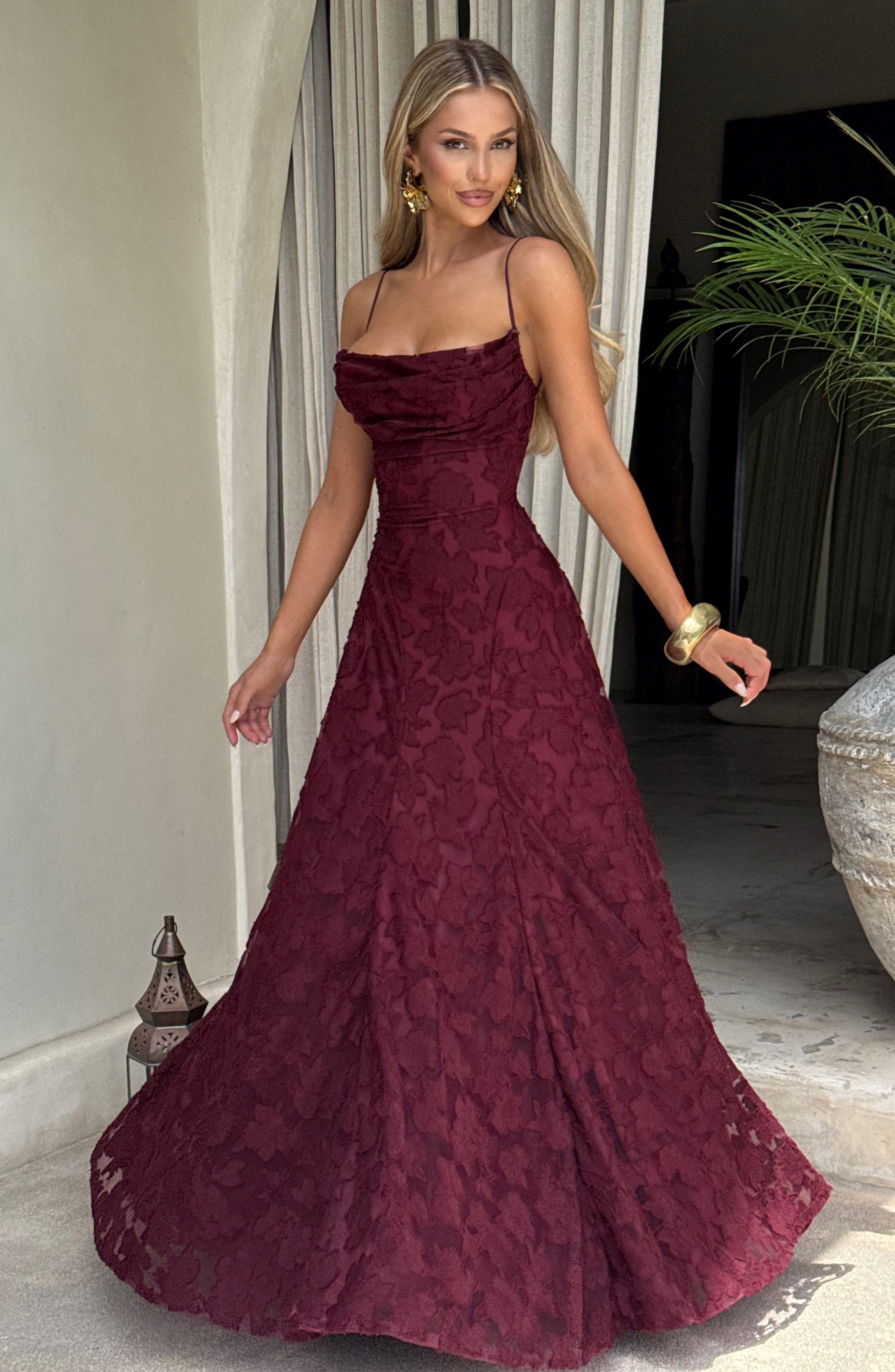 Ladies' maxi dress with waterfall neckline, spaghetti straps, floral pattern, and lace-up back