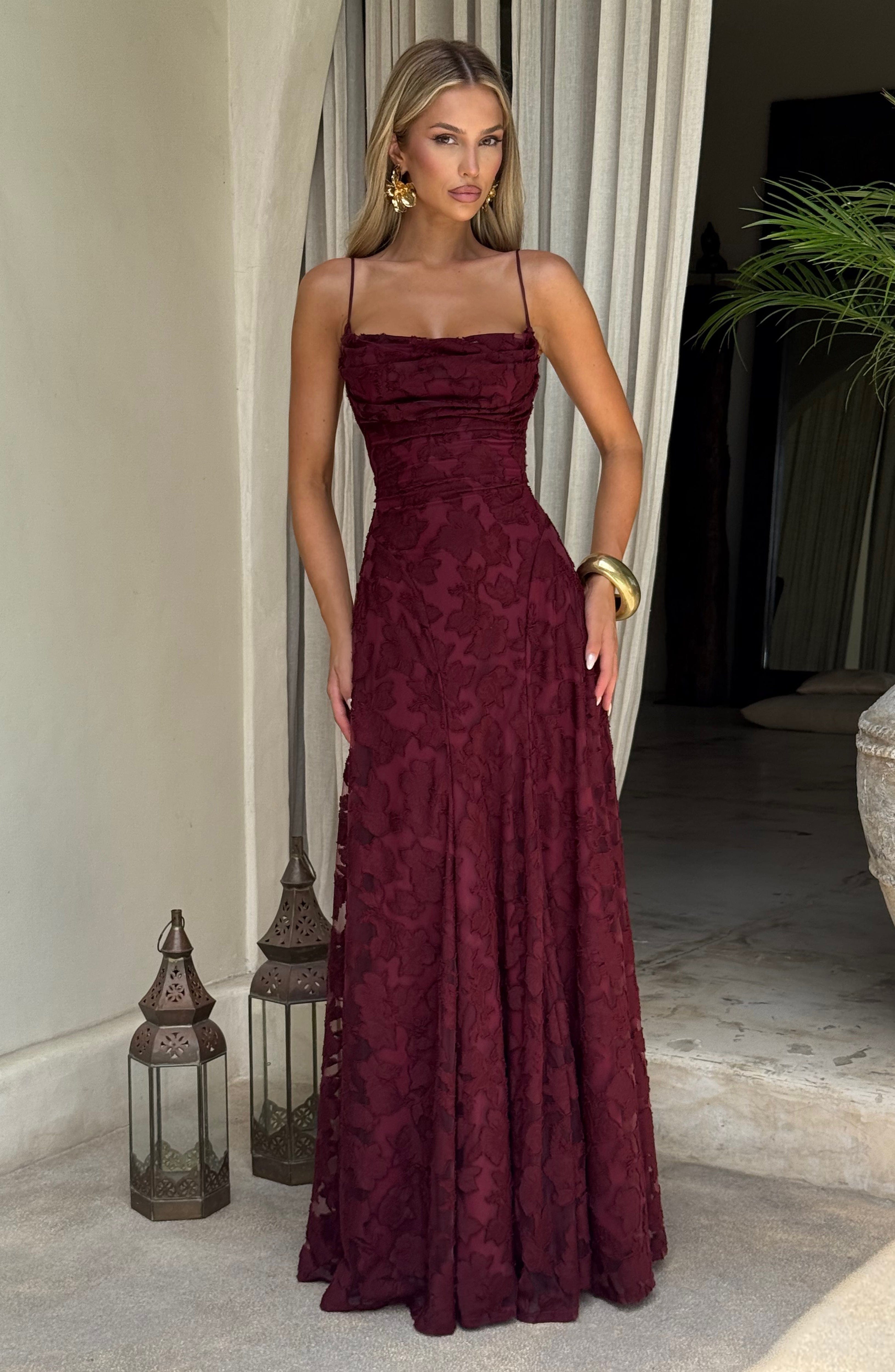 Ladies' maxi dress with waterfall neckline, spaghetti straps, floral pattern, and lace-up back