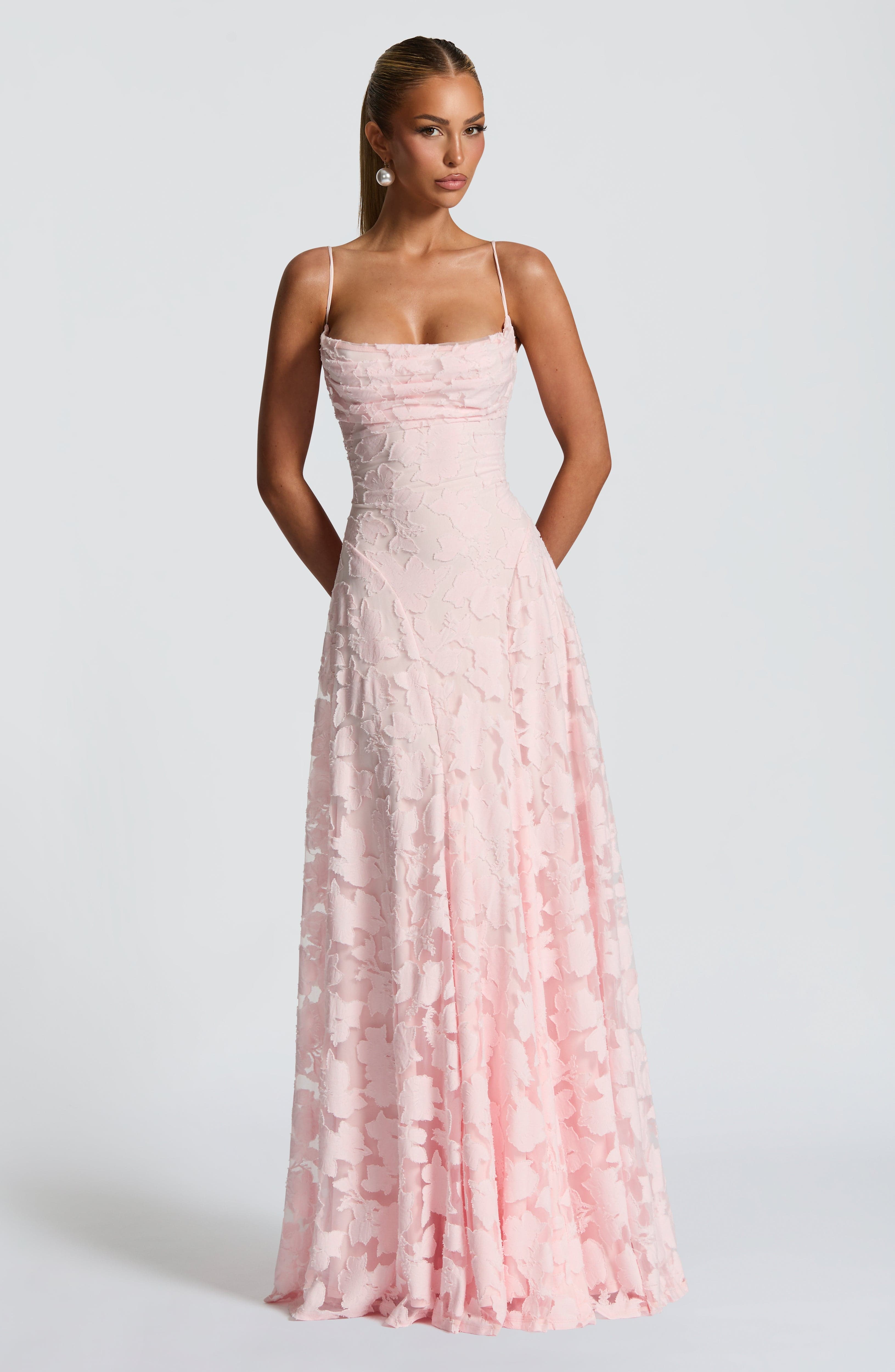 Ladies' maxi dress with waterfall neckline, spaghetti straps, floral pattern, and lace-up back
