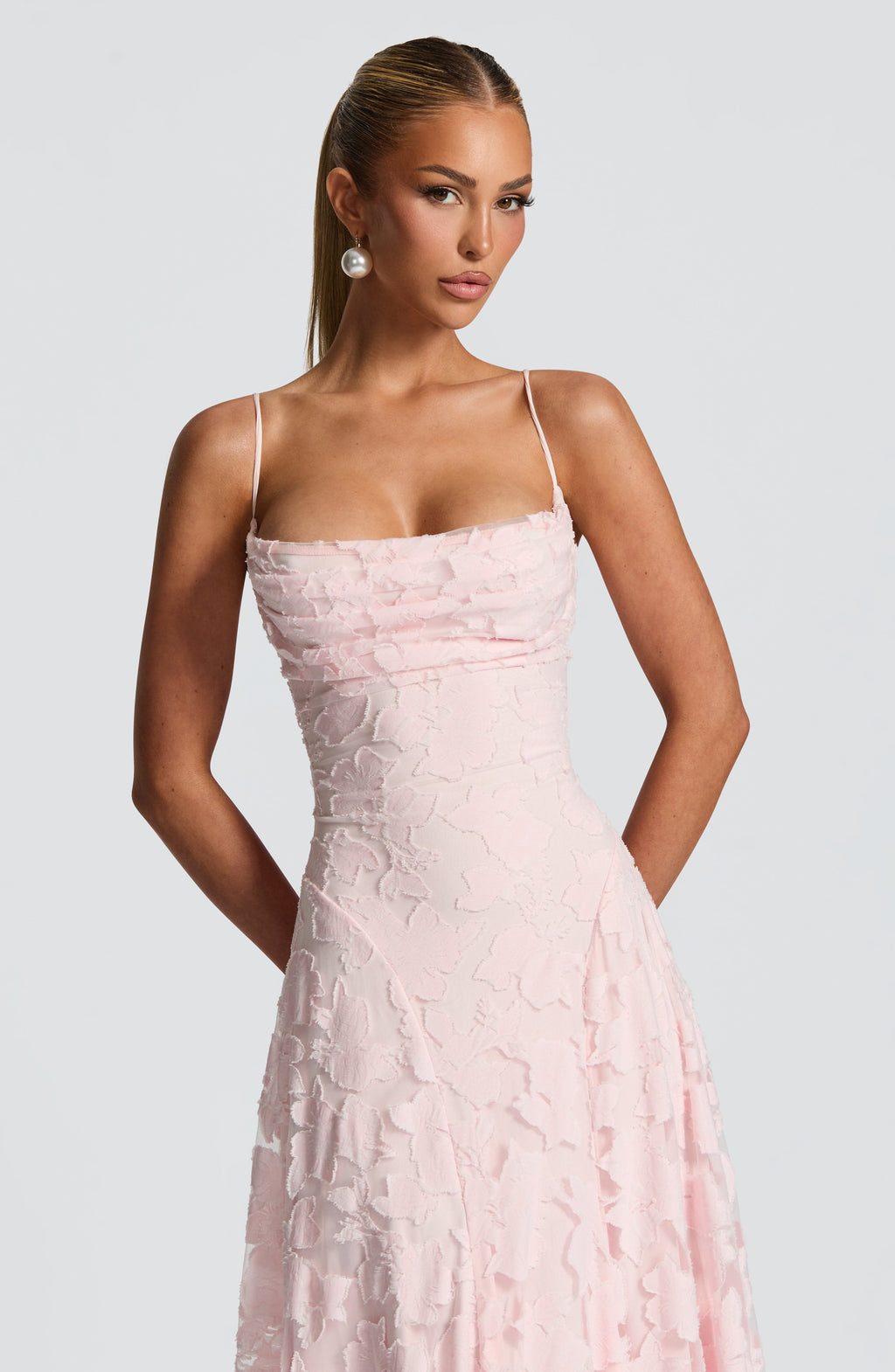 Ladies' maxi dress with waterfall neckline, spaghetti straps, floral pattern, and lace-up back
