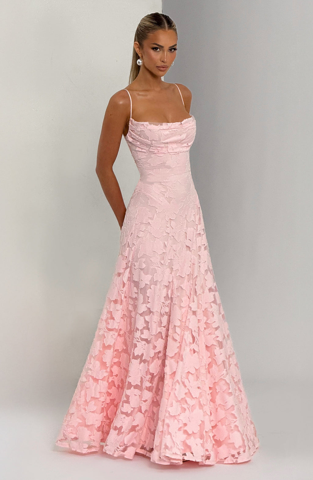 Ladies' maxi dress with waterfall neckline, spaghetti straps, floral pattern, and lace-up back