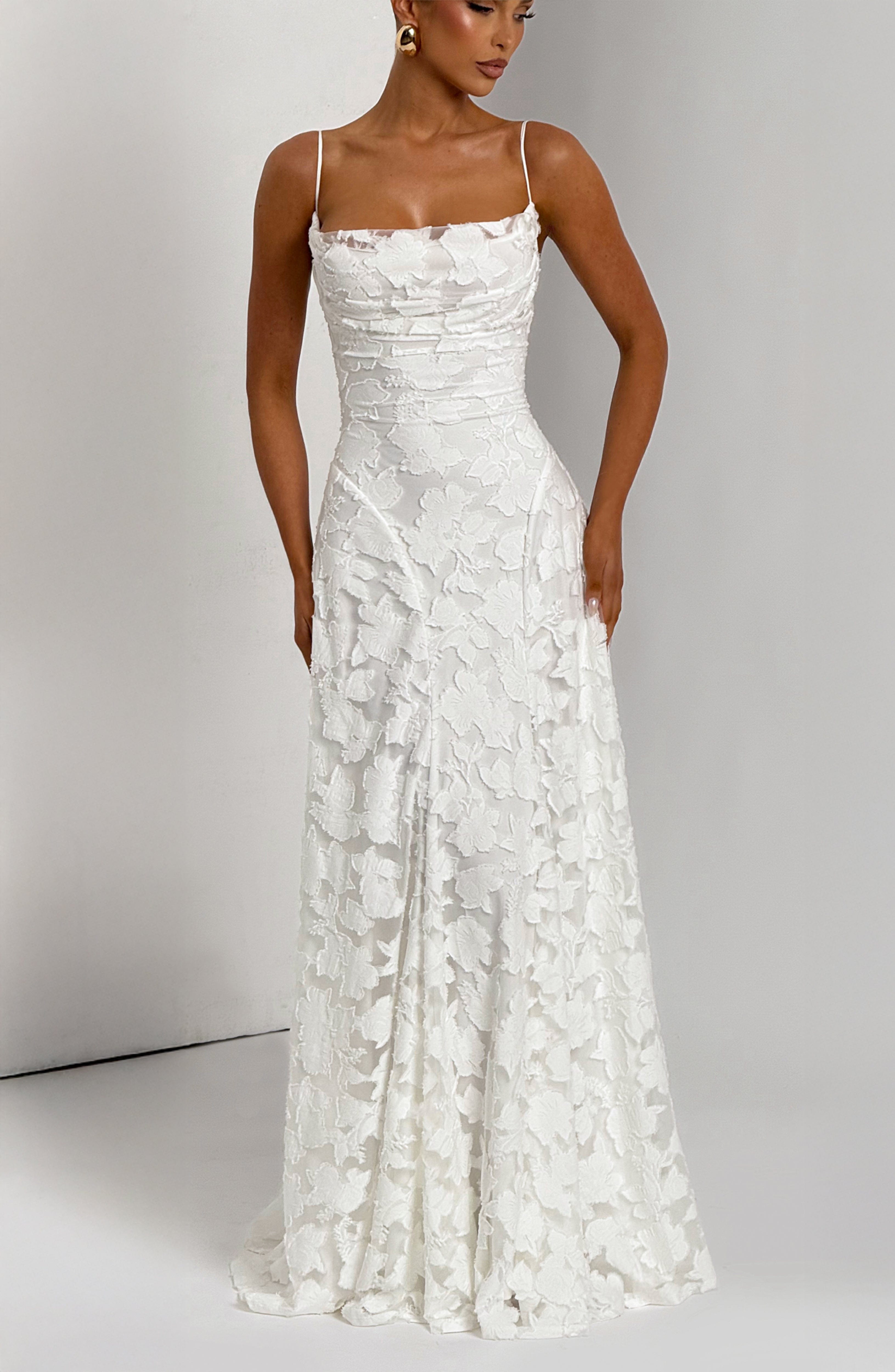 Ladies' maxi dress with waterfall neckline, spaghetti straps, floral pattern, and lace-up back