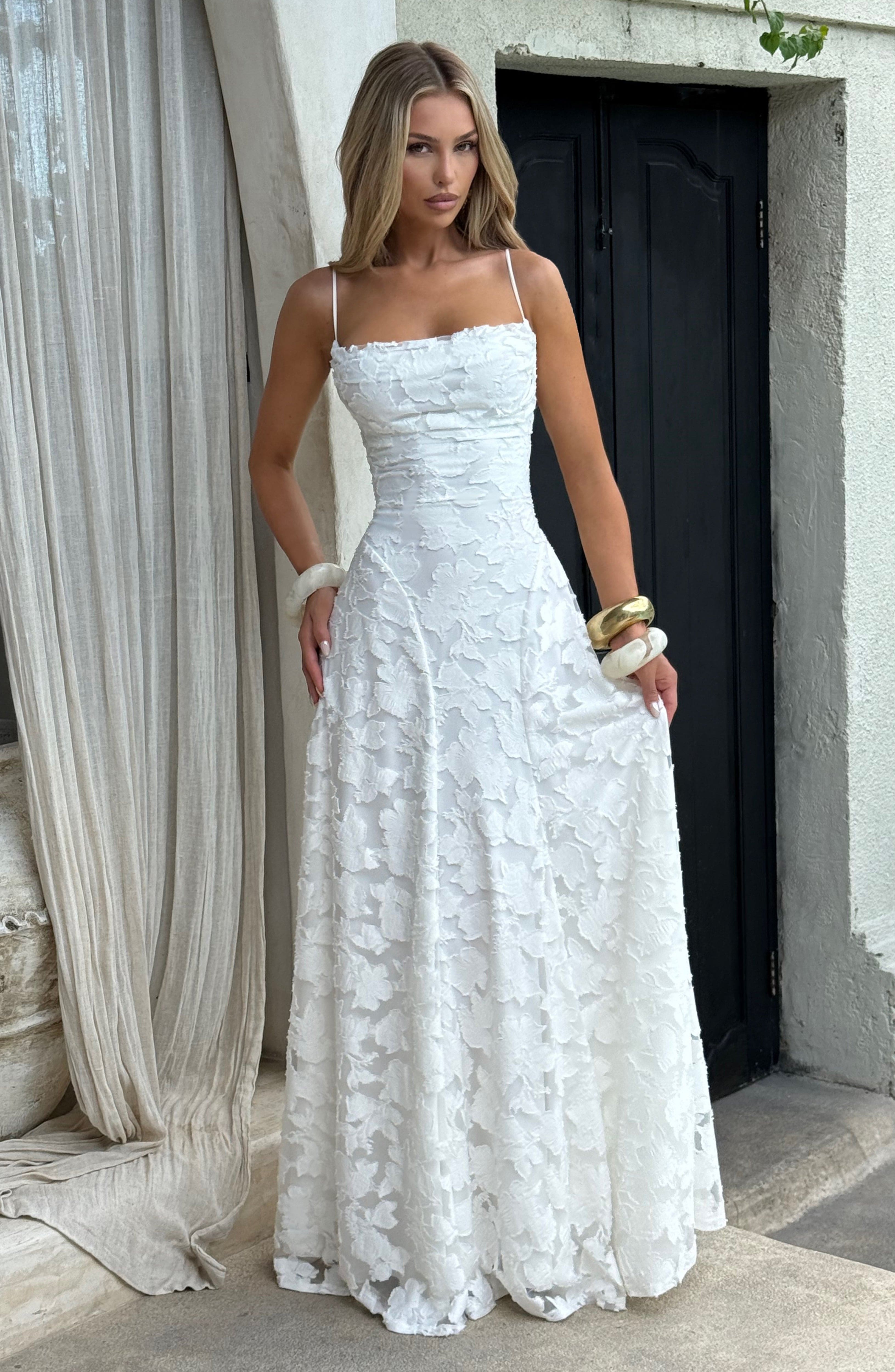 Ladies' maxi dress with waterfall neckline, spaghetti straps, floral pattern, and lace-up back